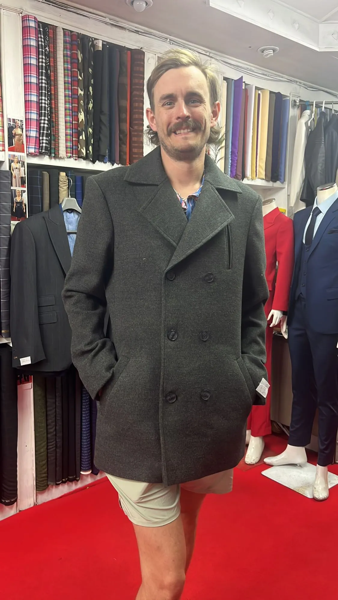 Man in a custom charcoal double-breasted coat at Oslo Tailor, Patong